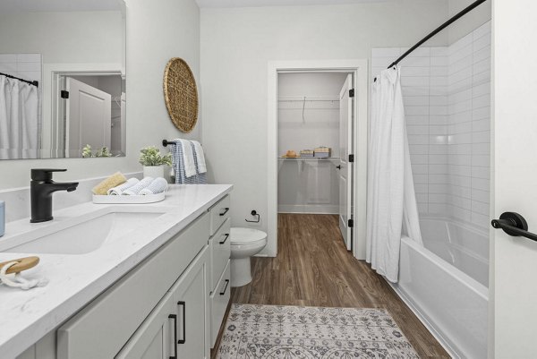 Contemporary bathroom with sleek fixtures at Evermore Apartments