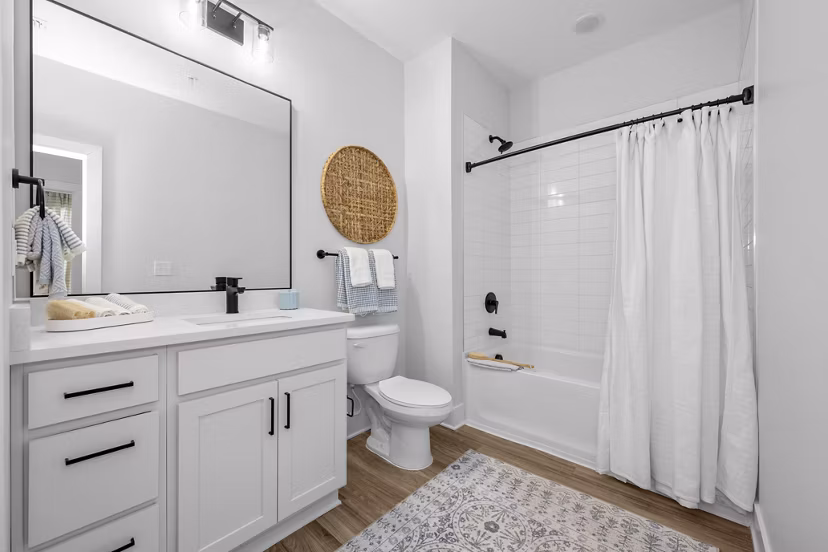 Modern bathroom with sleek fixtures at Evermore Apartments, a Greystar luxury residence
