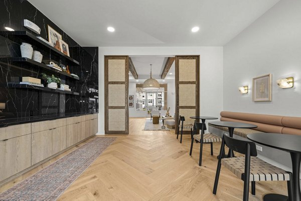 Clubhouse with modern decor and seating areas at Evermore Apartments, a luxury property by Greystar