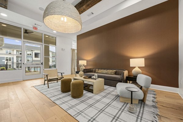 Contemporary clubhouse with stylish seating at Evermore Apartments, perfect for social gatherings and community events