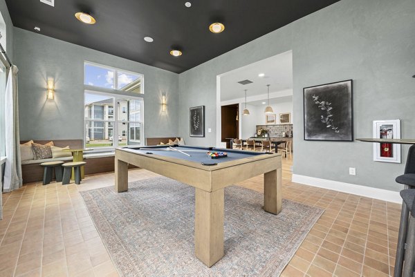 Modern clubhouse with spacious seating areas at Evermore Apartments