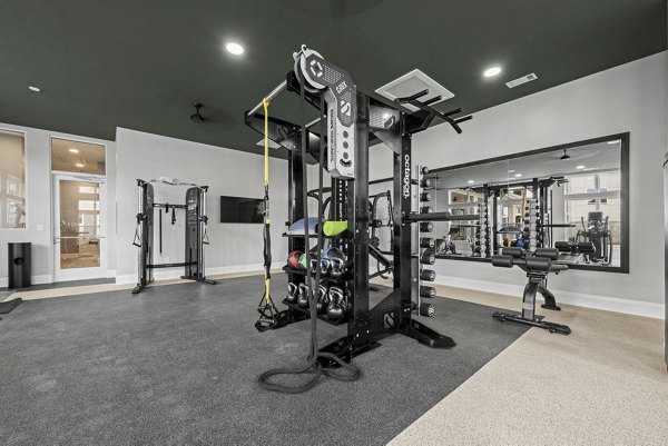 Modern fitness center with state-of-the-art equipment at Evermore Apartments for luxury wellness living