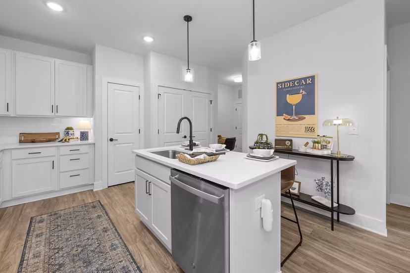 Modern kitchen with stainless steel appliances at Evermore Apartments