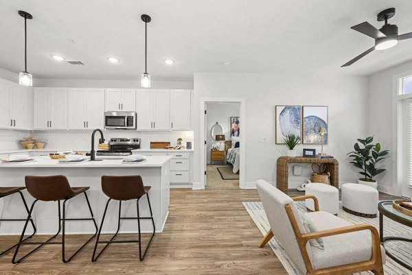 Modern kitchen with stainless steel appliances at Evermore Apartments