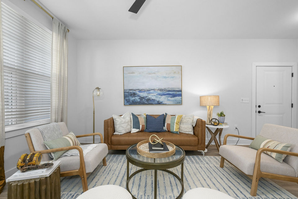 Spacious living room with modern furnishings at Evermore Apartments