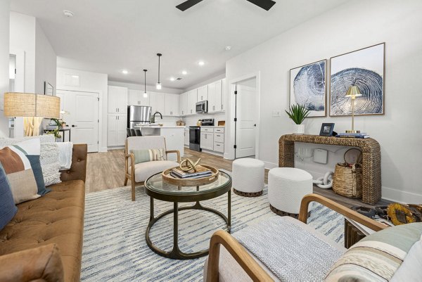Living room with modern decor and natural light at Evermore Apartments, luxury living in an urban setting
