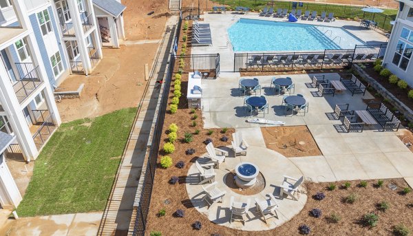 Cozy outdoor fire pit and seating area on patio at Evermore Apartments