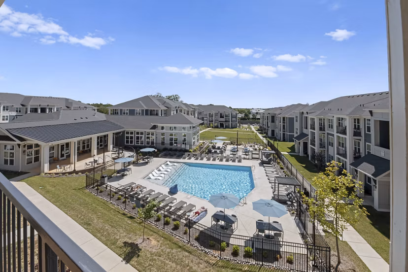 Modern outdoor pool with lounge chairs at Evermore Apartments, Greystar's luxury residences