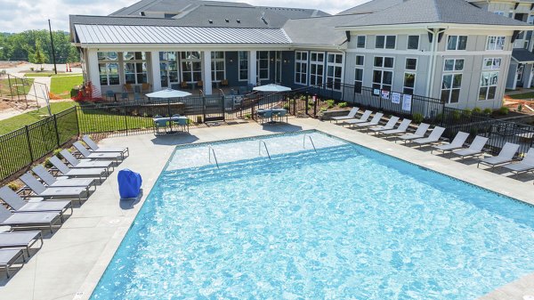 Modern outdoor pool with lounge chairs at Evermore Apartments, Greystar's luxury residences