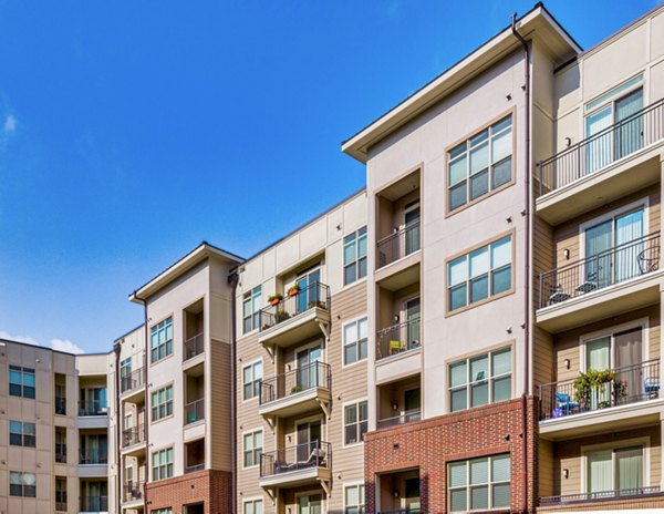 Modern luxury apartments with spacious balconies in a multi-story building