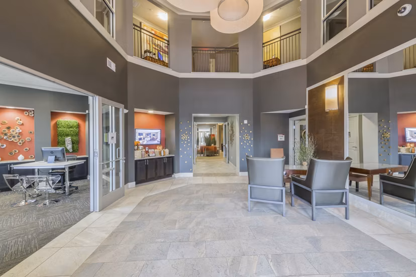 Clubhouse lobby with modern decor and seating at 401 Oberlin Apartments, a luxury property in downtown Raleigh
