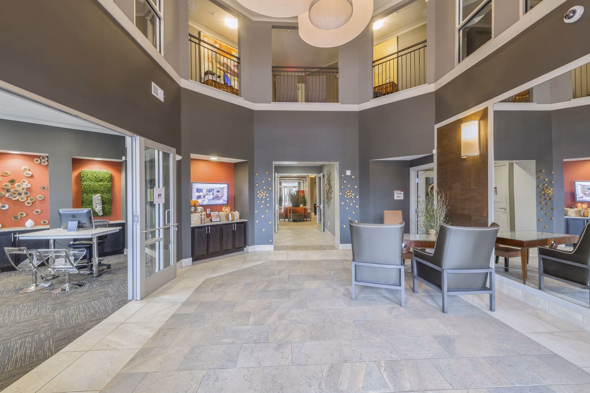 Clubhouse lobby with modern decor and seating at 401 Oberlin Apartments, a luxury property in downtown Raleigh