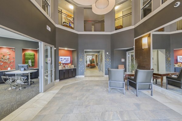 Clubhouse lobby with modern decor and seating at 401 Oberlin Apartments, a luxury property in downtown Raleigh