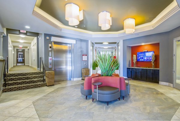 Clubhouse and lobby at 401 Oberlin Apartments featuring modern decor and cozy seating areas in vibrant city locale