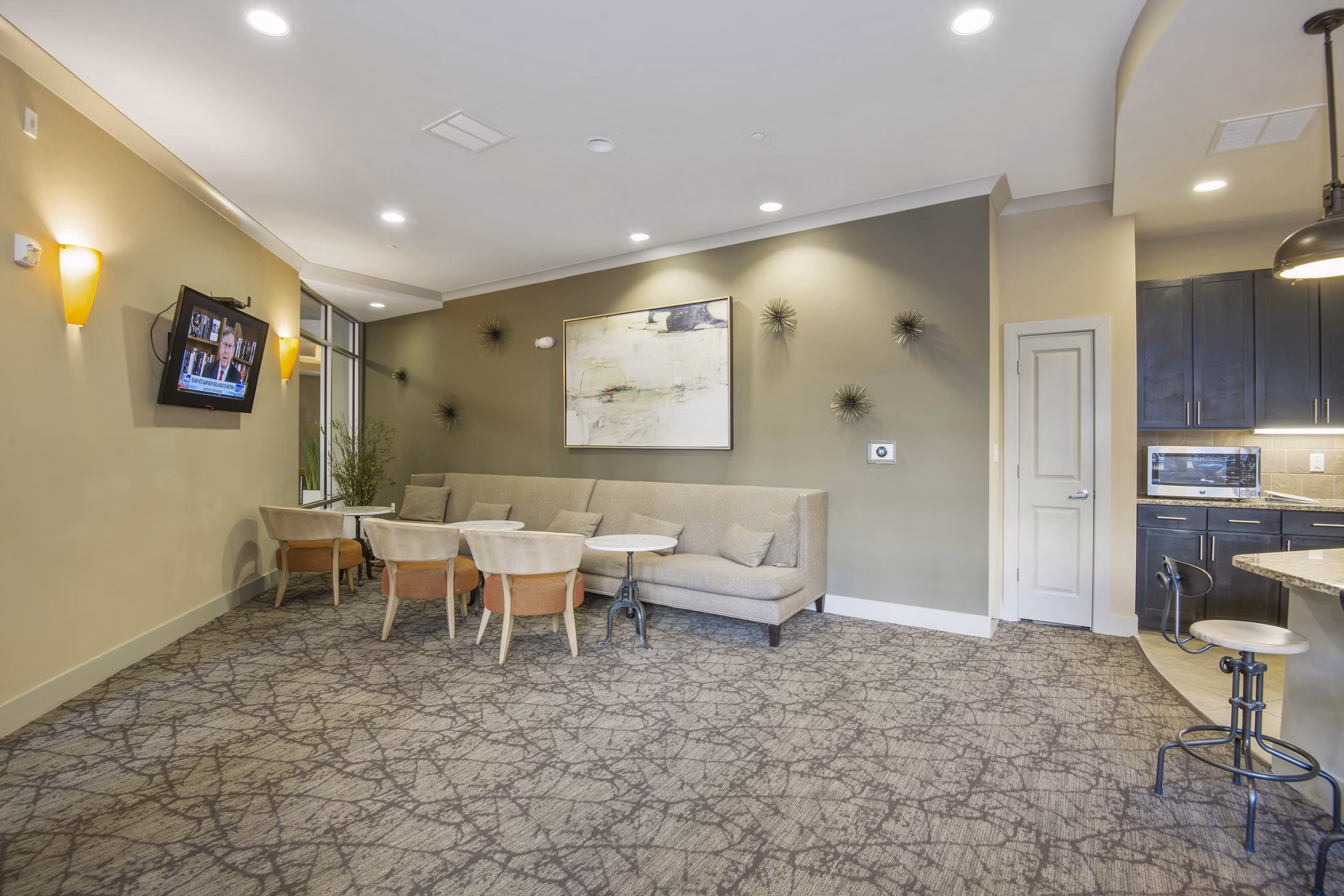 Clubhouse lobby featuring sleek modern decor at 401 Oberlin Apartments, a luxury Greystar community in Raleigh
