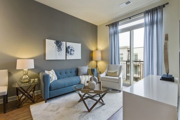 Spacious living room featuring modern decor at 401 Oberlin Apartments, a luxury community in Raleigh, NC