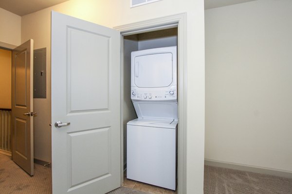 Laundry room with modern appliances at 401 Oberlin Apartments