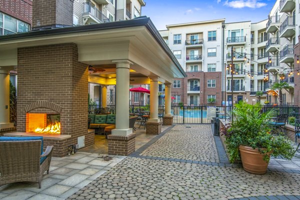 Cozy patio with fire pit at 401 Oberlin Apartments, a luxury Greystar property