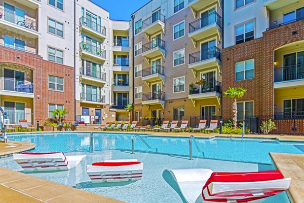 Infinity pool with sun deck at 401 Oberlin Apartments, a luxury Greystar community in Raleigh