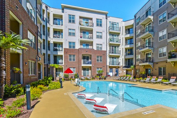 Rooftop pool at 401 Oberlin Apartments offering stunning views of Raleigh skyline, perfect for relaxation and leisure