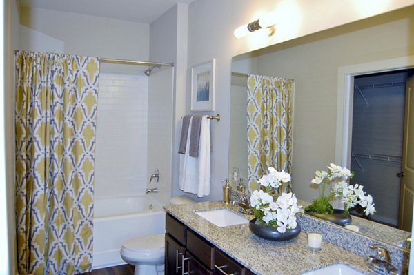 Bathroom with sleek fixtures and modern design in 5115 Park Place Apartments