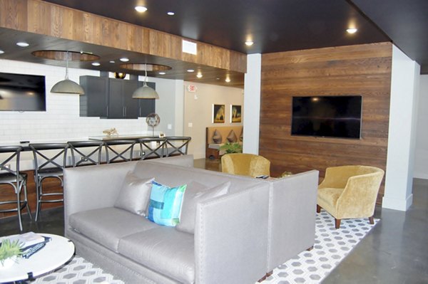 Clubhouse with modern decor and communal seating area at 5115 Park Place Apartments in Houston