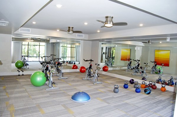 Yoga/spin studio with modern equipment at 5115 Park Place Apartments, a Greystar luxury property in a vibrant community