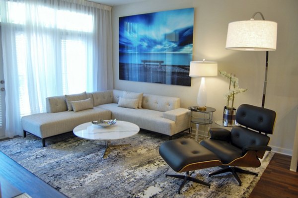 Spacious living room with modern furnishings at 5115 Park Place Apartments, ideal for luxury living in a vibrant community setting