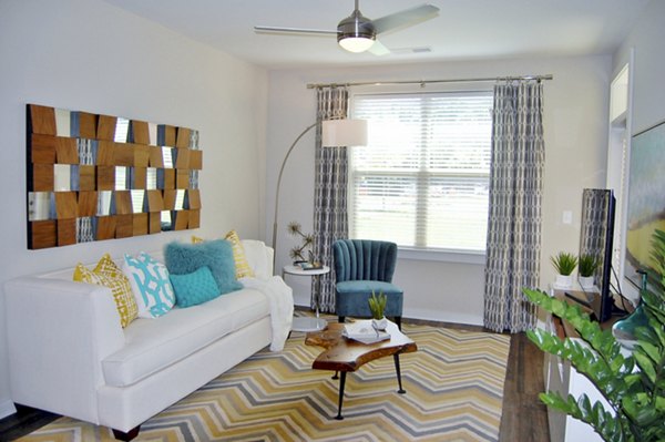 Spacious living room with modern decor in 5115 Park Place Apartments