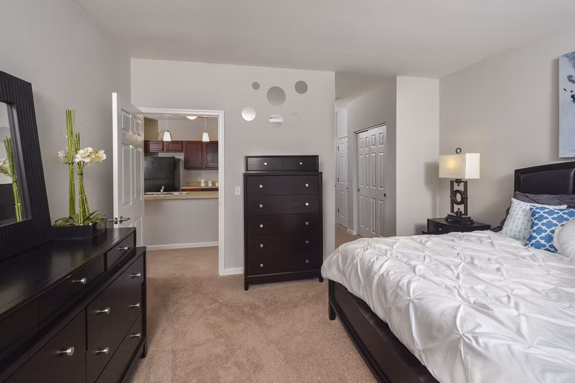 Cozy bedroom with modern decor at 62 Eleven Apartments, featuring luxury living amenities for an exceptional lifestyle