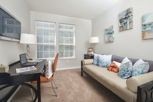 Cozy bedroom home office with modern desk and decor at 62 Eleven Apartments