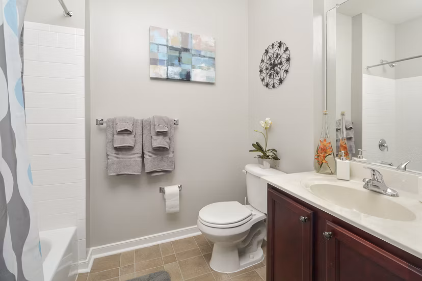 Luxurious bathroom with modern fixtures at 62 Eleven Apartments - stylish and functional living spaces in the heart of the city