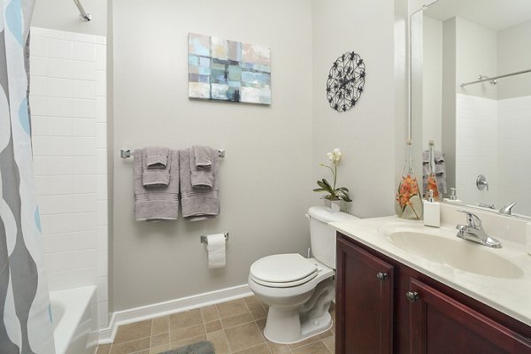 Luxurious bathroom with modern fixtures at 62 Eleven Apartments - stylish and functional living spaces in the heart of the city