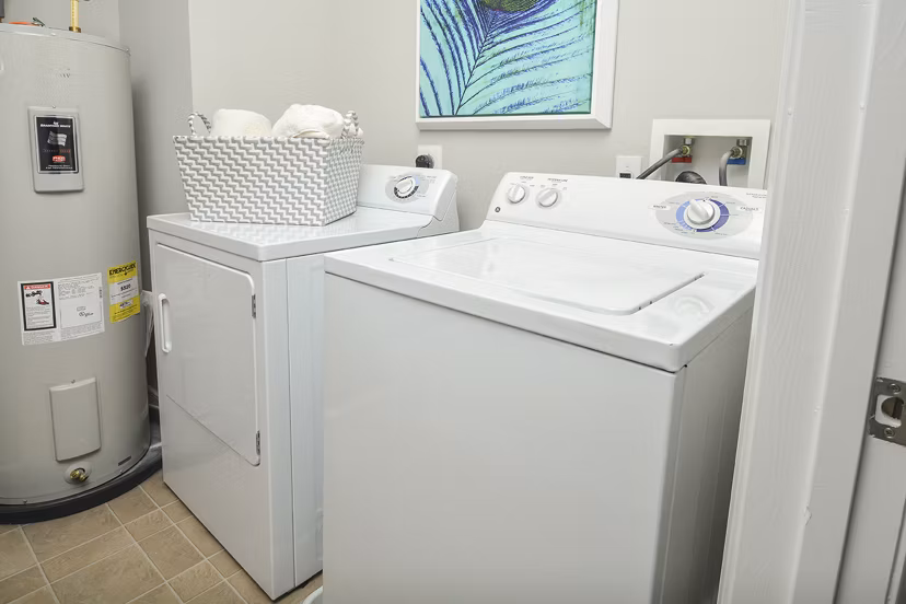 Laundry room with modern appliances at 62 Eleven Apartments, luxury living with convenient amenities in the Greystar community
