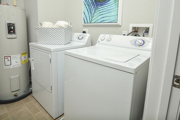 Laundry room with modern appliances at 62 Eleven Apartments, luxury living with convenient amenities in the Greystar community