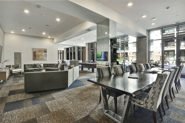 Clubhouse with modern decor and seating at 675 N Highland Apartments, ideal for social gatherings and community events