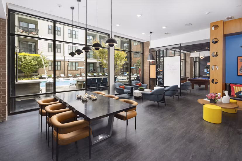 Clubhouse with modern design at 675 N Highland Apartments, featuring cozy seating and stylish decor