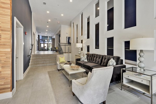 Clubhouse with cozy seating and modern design at 675 N Highland Apartments