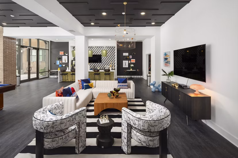 Clubhouse with modern design and chic furnishings at 675 N Highland Apartments, a Greystar luxury community in vibrant Atlanta