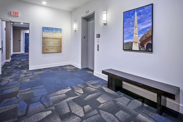 Clubhouse with modern design and chic furnishings at 675 N Highland Apartments, a Greystar luxury community in vibrant Atlanta