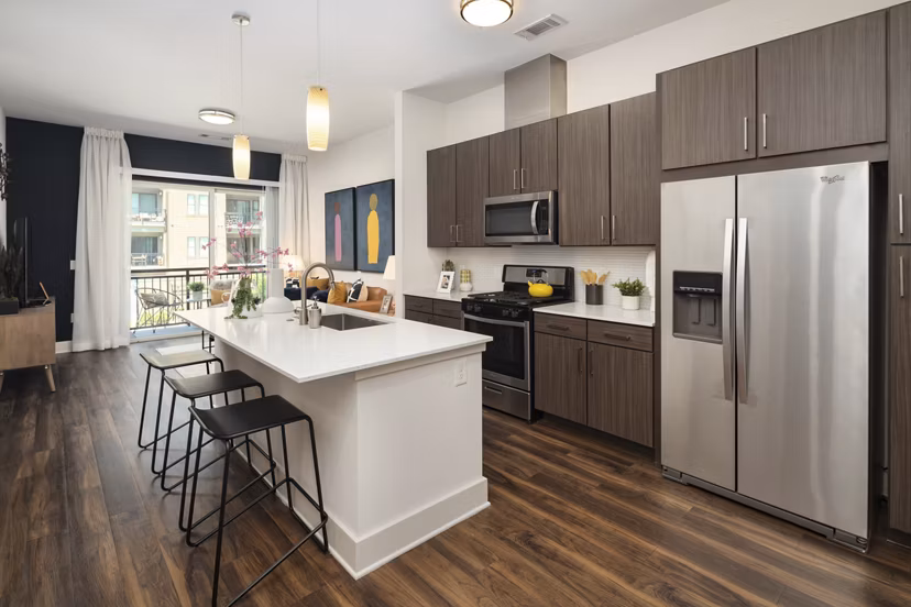 Modern kitchen with stainless steel appliances at 675 N Highland Apartments
