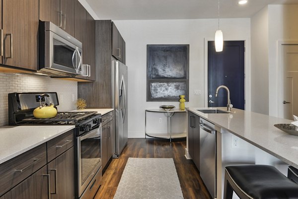 Spacious kitchen with modern appliances at 675 N Highland Apartments, offering luxury living in the heart of the city