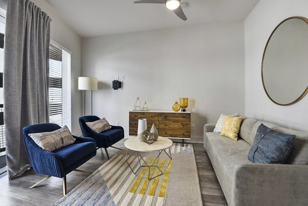 Modern living room with sleek furnishings at 675 N Highland Apartments, luxury community in Atlanta