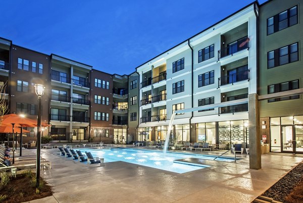 Inviting outdoor pool area at 675 N Highland Apartments, ideal for relaxation and leisure in a luxury setting