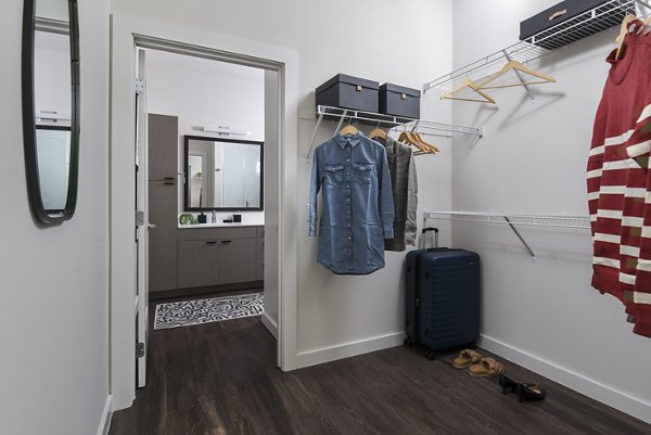 Spacious closet with built-in shelving in bedroom at Alta 801 Apartments, a Greystar luxury community