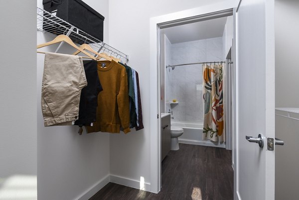 Walk-in closet with built-in shelving at Alta 801 Apartments