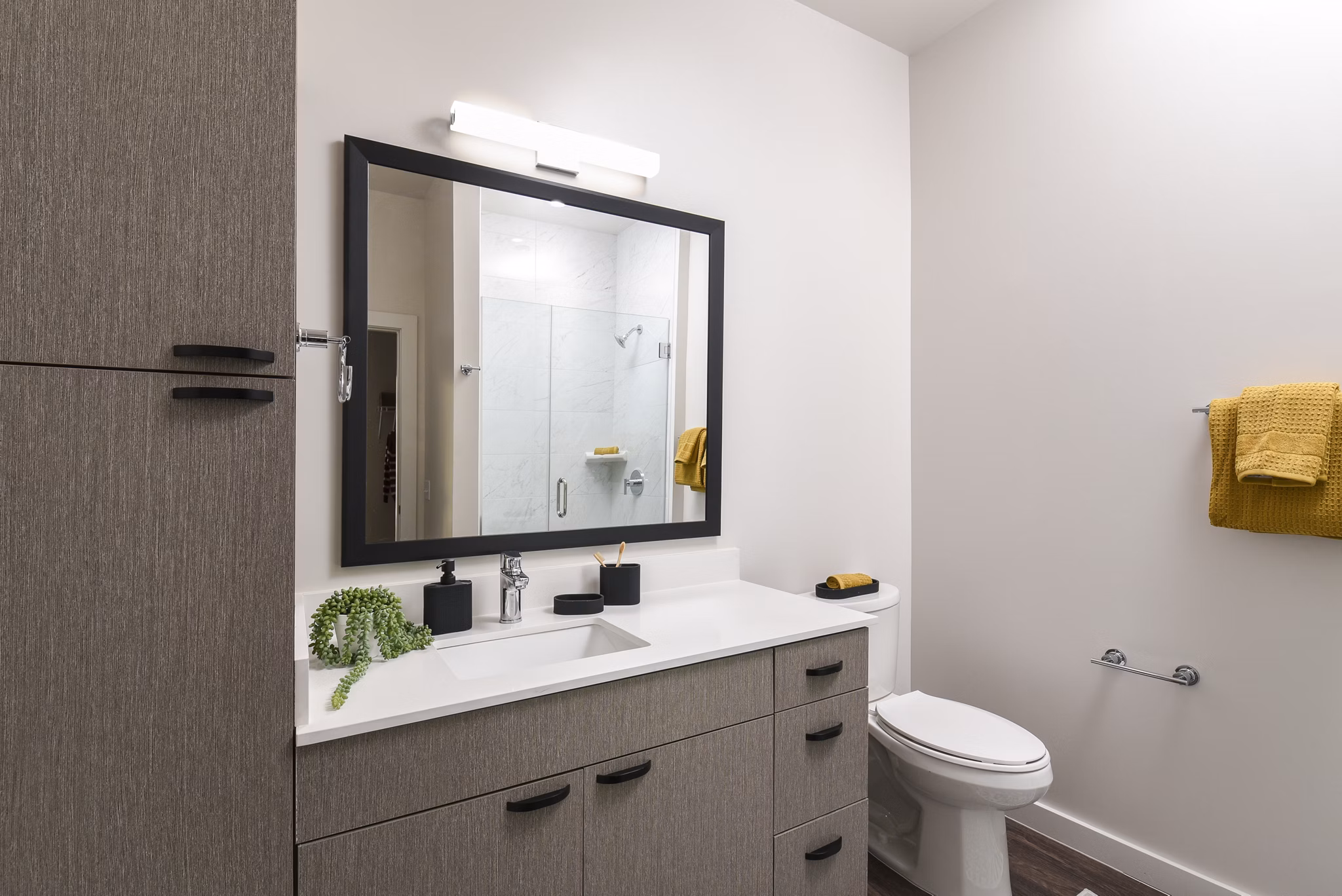 Luxurious bathroom with modern fixtures at Alta 801 Apartments, featuring sleek design and spacious layout