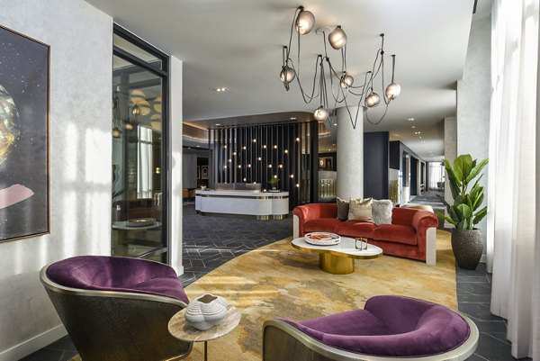 Clubhouse featuring modern design and social spaces at Alta 801 Apartments