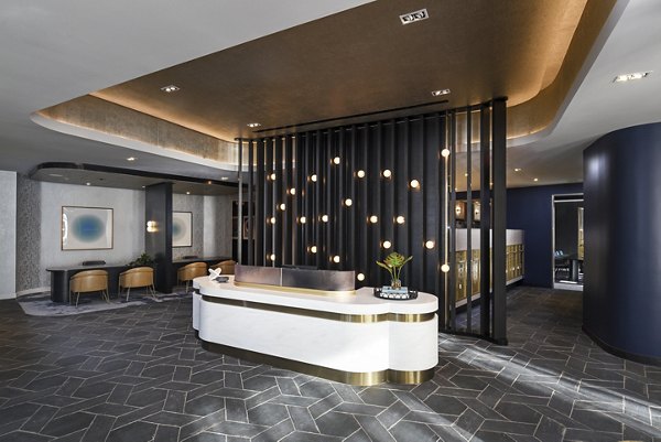 Clubhouse with modern furnishings and vibrant decor at Alta 801 Apartments luxury community
