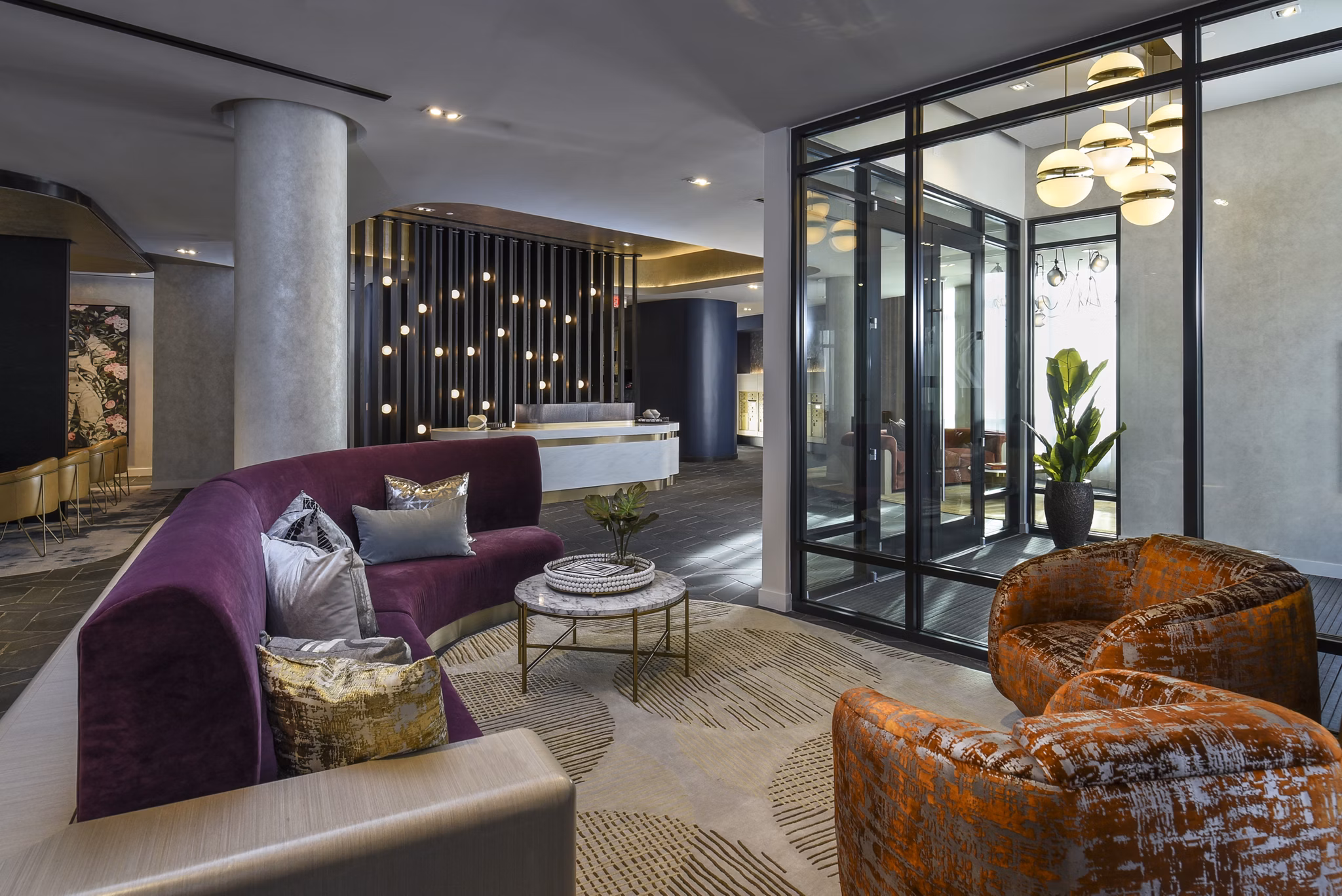 Clubhouse featuring elegant seating and modern decor at Alta 801 Apartments, a luxury community by Greystar